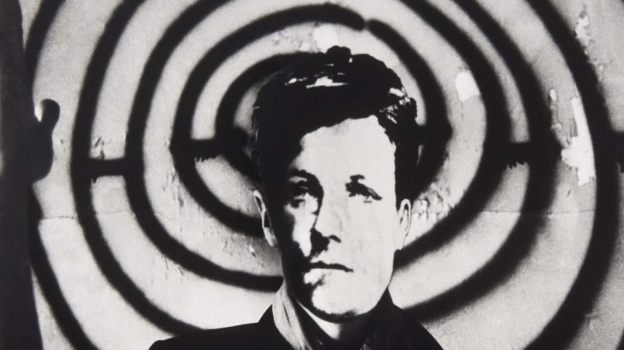 Arthur Rimbaud in New York backdrop