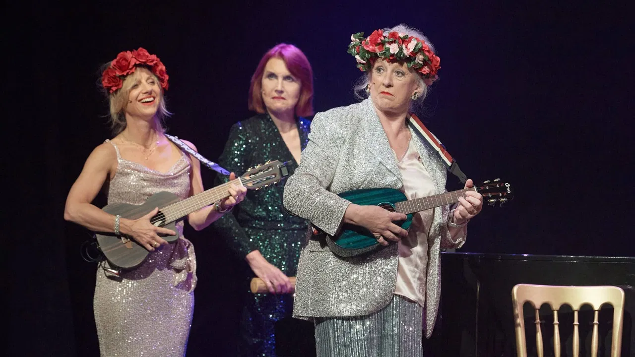 FASCINATING AÏDA: The 40th Anniversary Show! backdrop