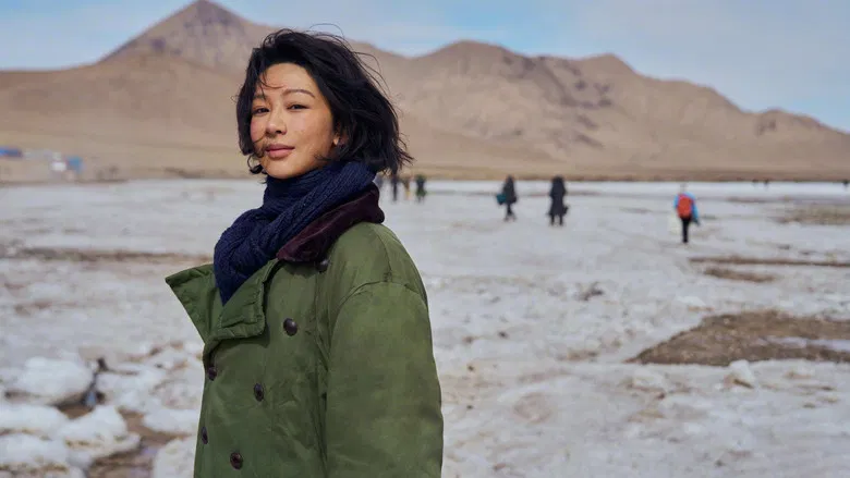 Characters navigating the snowy terrain