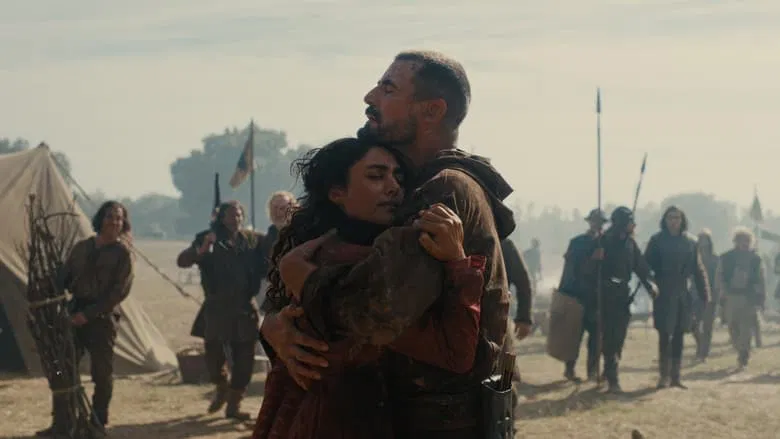 Claes Bang as William Tell aiming his crossbow in a snowy forest