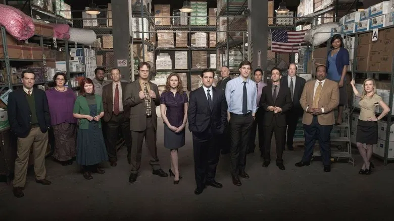 The Dunder Mifflin team in the conference room