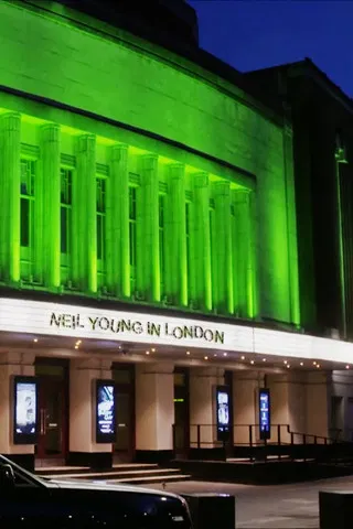 Neil Young in London poster background