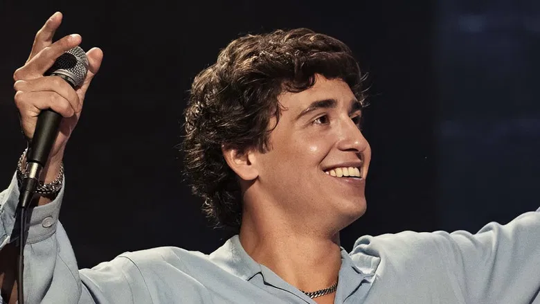 Marcello Hernández performing with high energy at the Olympia Theater